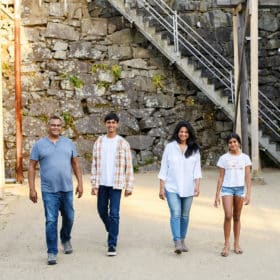 family of four walking toward the camera in the natural light in folsom california