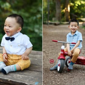 young boy sitting on a training bike and smiling, baby boy wearing a bowtie and laughing