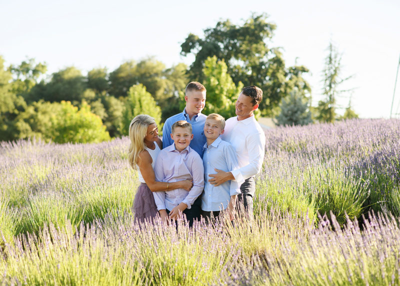 family of five standing in a lavender field during summer photo session in newcastle california