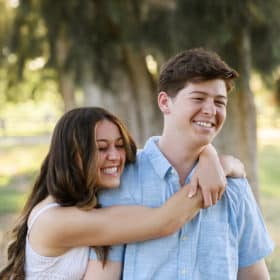 sister hugging brother during senior portraits in sacramento california