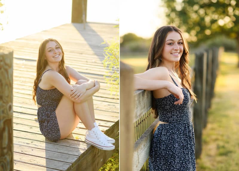 senior in high school posing on a dock wearing a blue dress, posing against a wooden fence