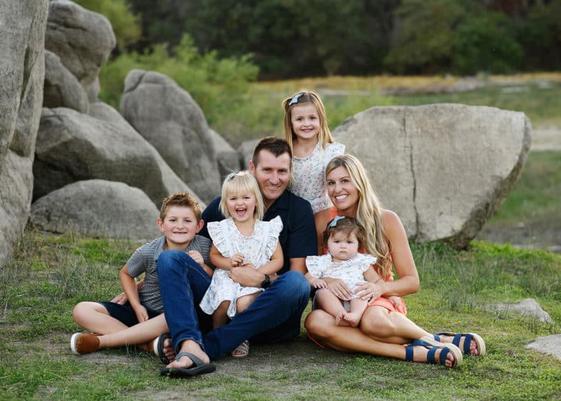 family of six looking at the photographer during summer session in granite bay california