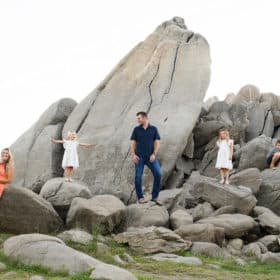 granite bay family photographer taking pictures on a rock formation in granite bay california