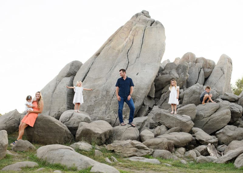 granite bay family photographer taking pictures on a rock formation in granite bay california