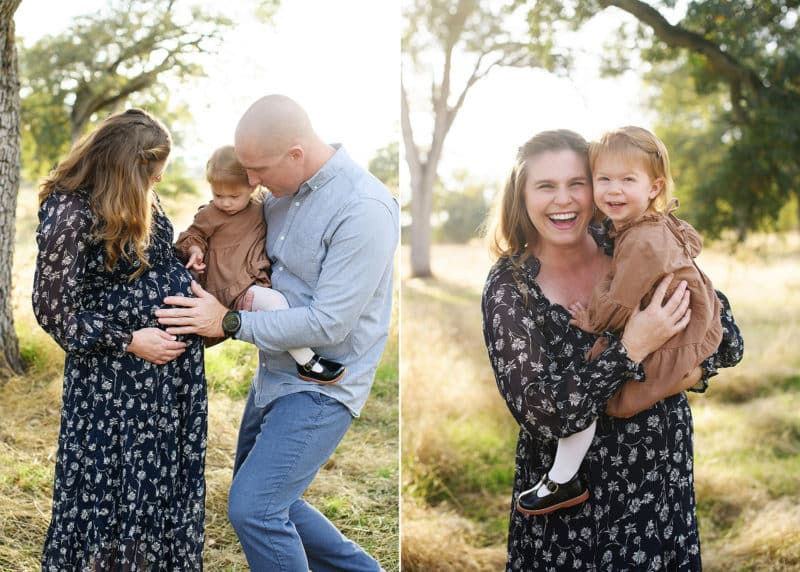 folsom maternity photographer session with a family of three, mom and daughter smiling at the camera, young girl holding mom's pregnant belly