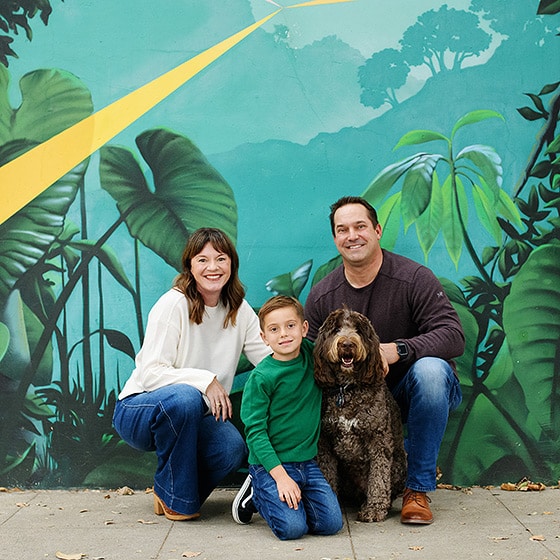 downtown sacramento photographer taking pictures of a family of three with dog