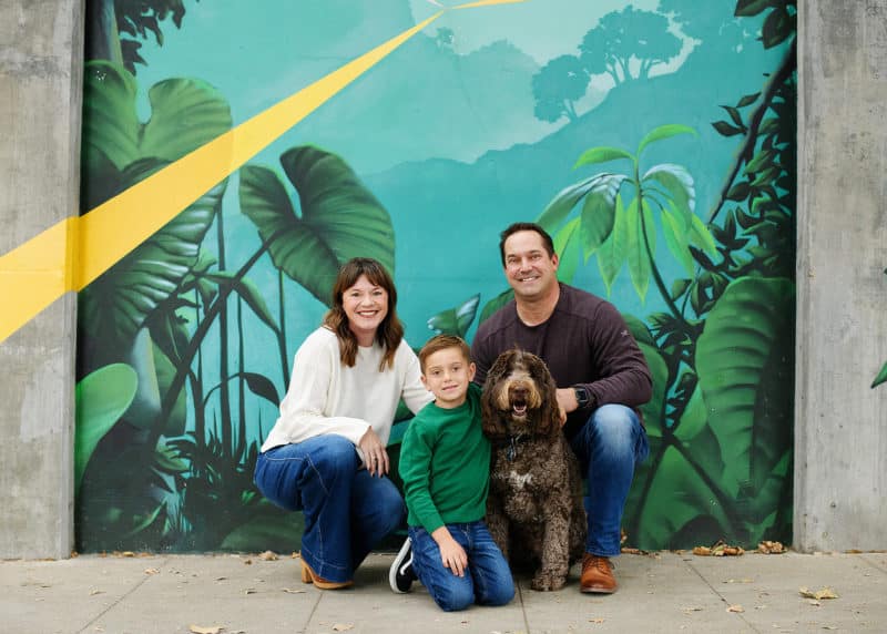 downtown sacramento photographer taking pictures of a family of three with dog