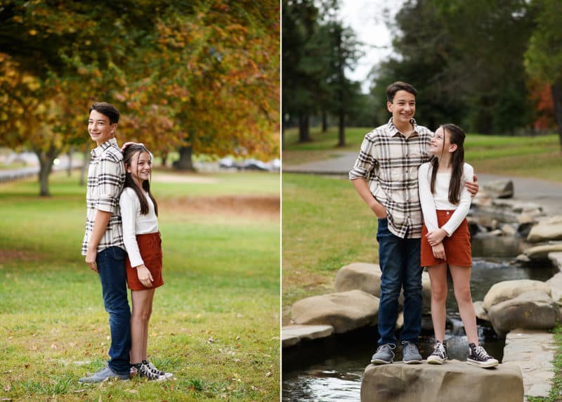 siblings comparing height and laughing together during fall family sessions with sacramento photographer