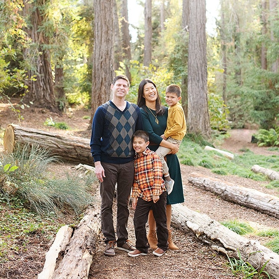 davis photographer taking family pictures with a family of four in the middle of redwood forest