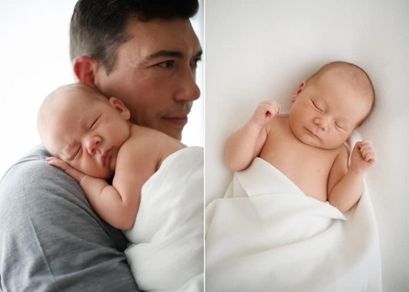 newborn baby on dad's shoulders, sleeping peacefully wrapped in a white blanket