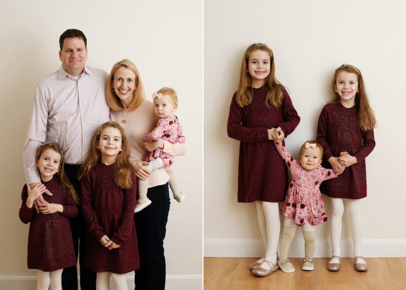 family of five posing for a photo in the studio with sacramento photographer jill carmel; three sisters holding hands and smiling