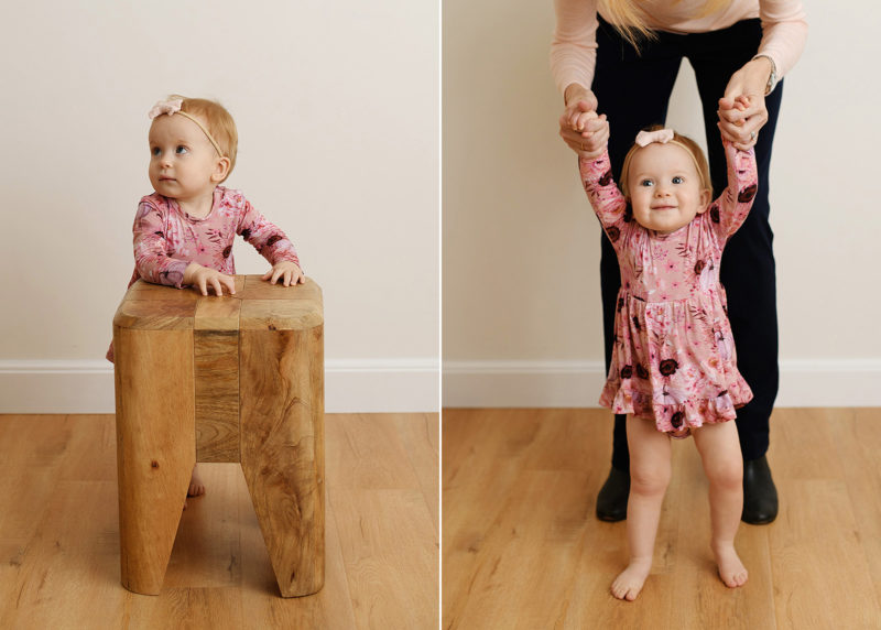 one year old girl wearing pink and smiling during studio session with sacramento photographer jill carmel