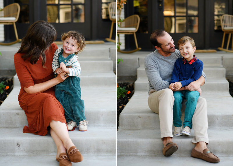 mom sitting with young son on the front steps; dad with young son sitting in front of home